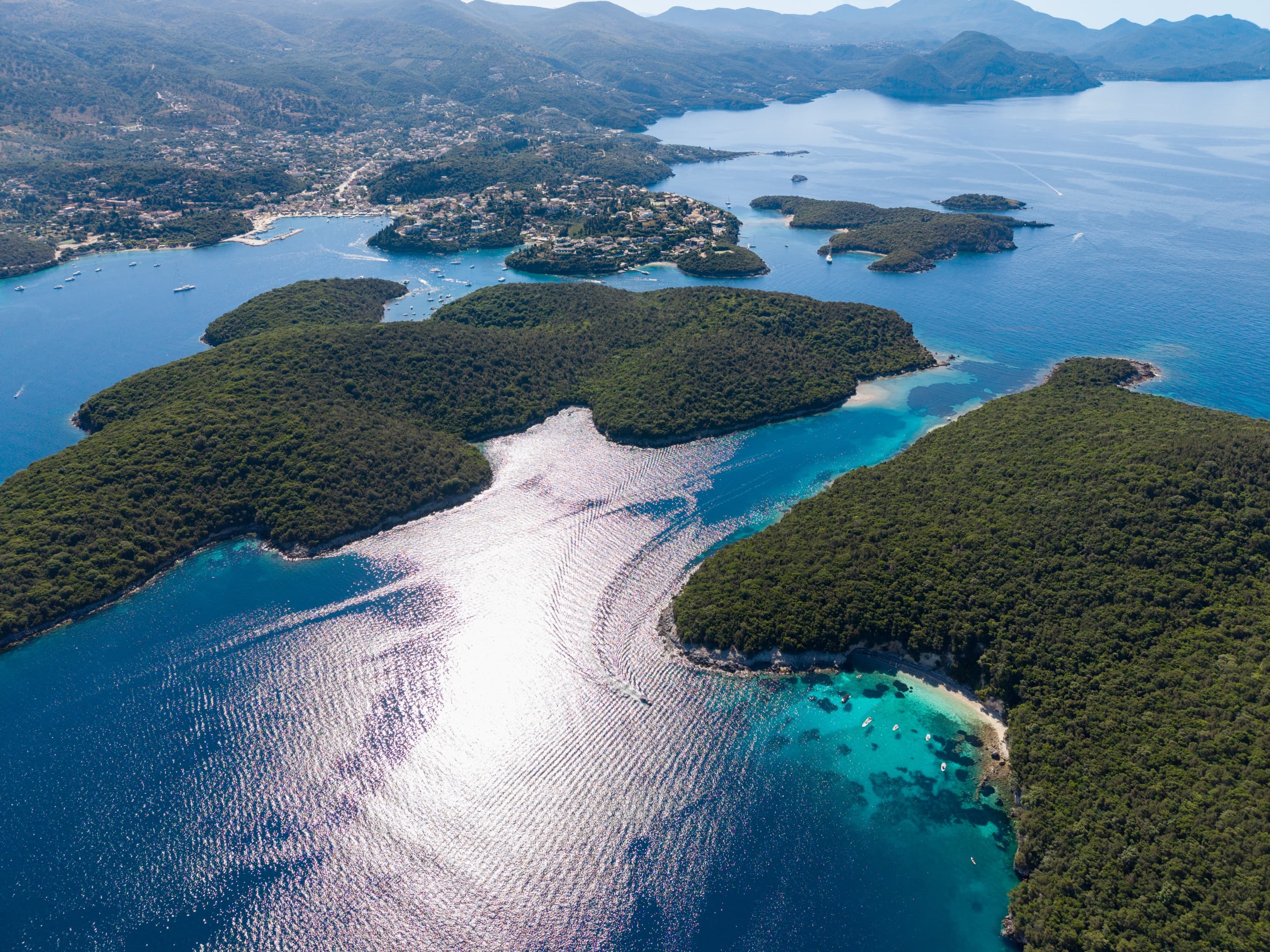 Aerial view of the emerald islets and turquoise channels of Syvota